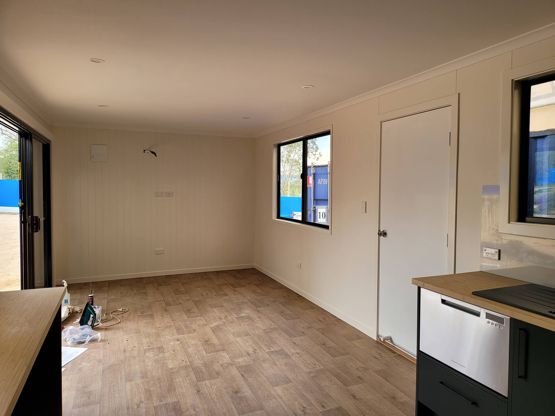 Empty Interior of a portable building of alan frost range with glass doors and glass windows