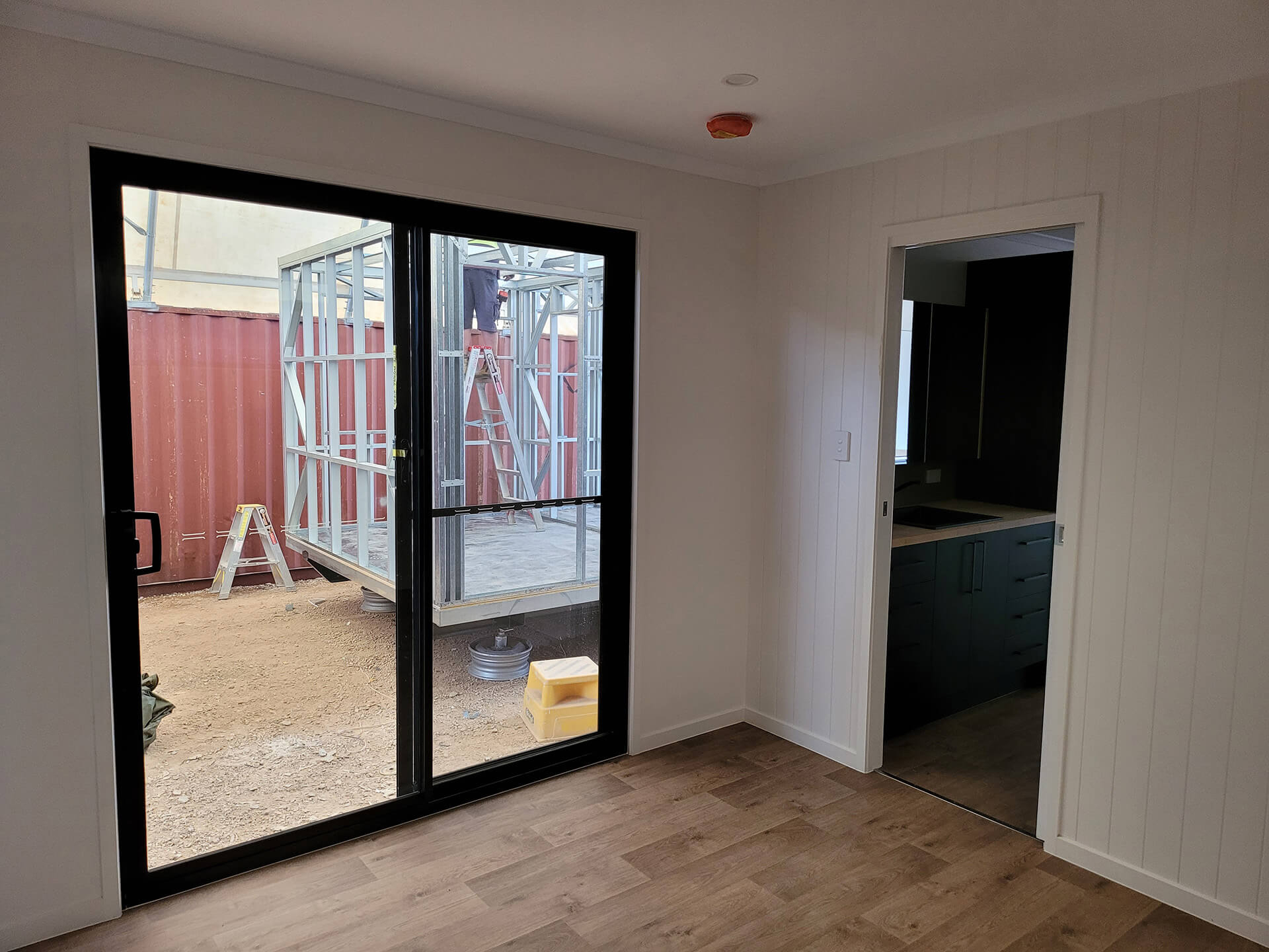 Interior of a portable building of alan frost product range with glass doors