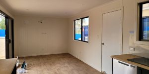 Empty Interior of a portable building of alan frost range with glass doors and glass windows